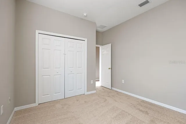 a view of a house with backyard porch and garden