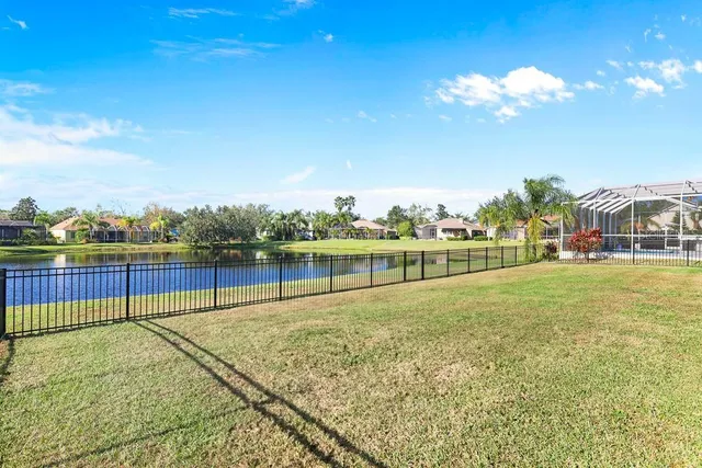 a view of a swimming pool with a yard