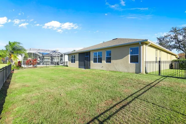 a view of a house with a big yard