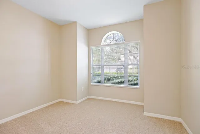 a view of a workspace with a bookshelf