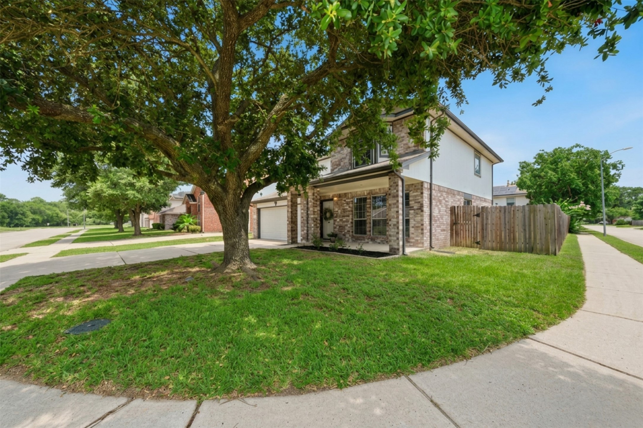 2446 Halstead Drive Spring, TX 77386 - Photo 4 of 45 Situated on a corner lot with a large shade tree.
