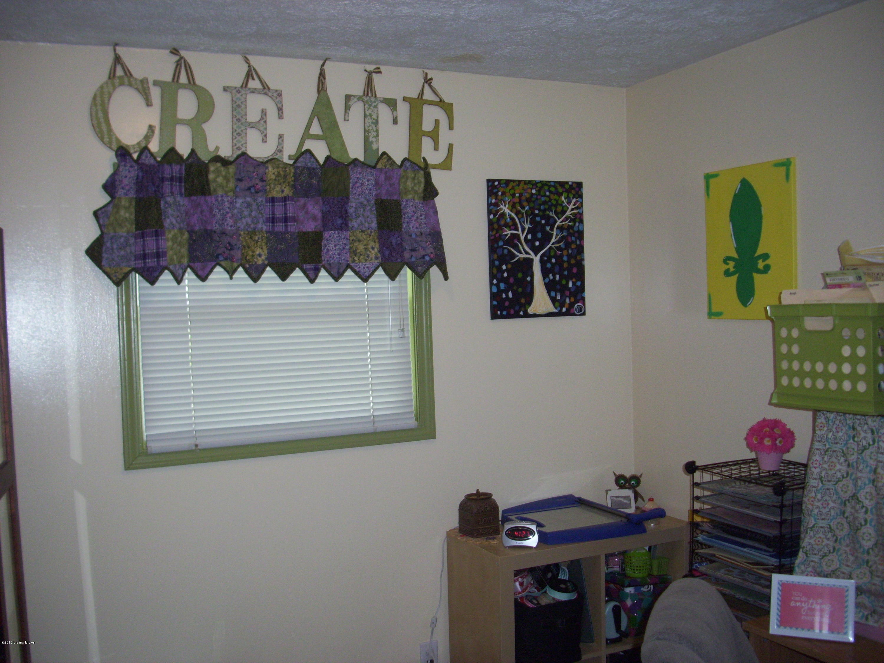 10001 Robsion Road Louisville, KY 40299 - Photo 14 of 23 Bedroom. This room does not have a closet, the closet is in the hallway. This bedroom being used as a craft room.