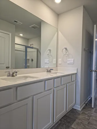 a view of a bathroom with mirror