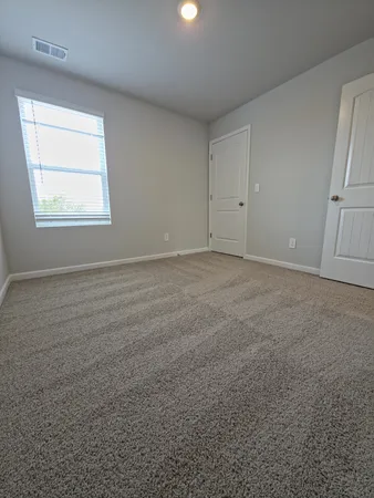 en empty room with windows