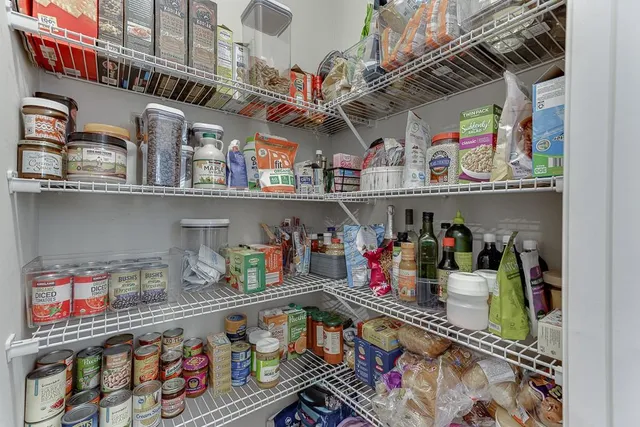 a bedroom with bed and a window