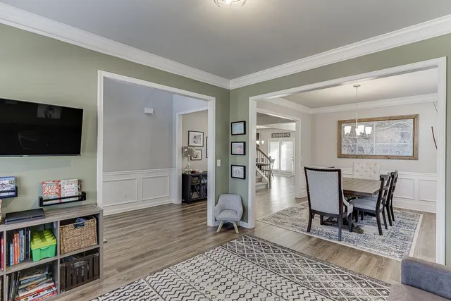 a dining room with furniture and window