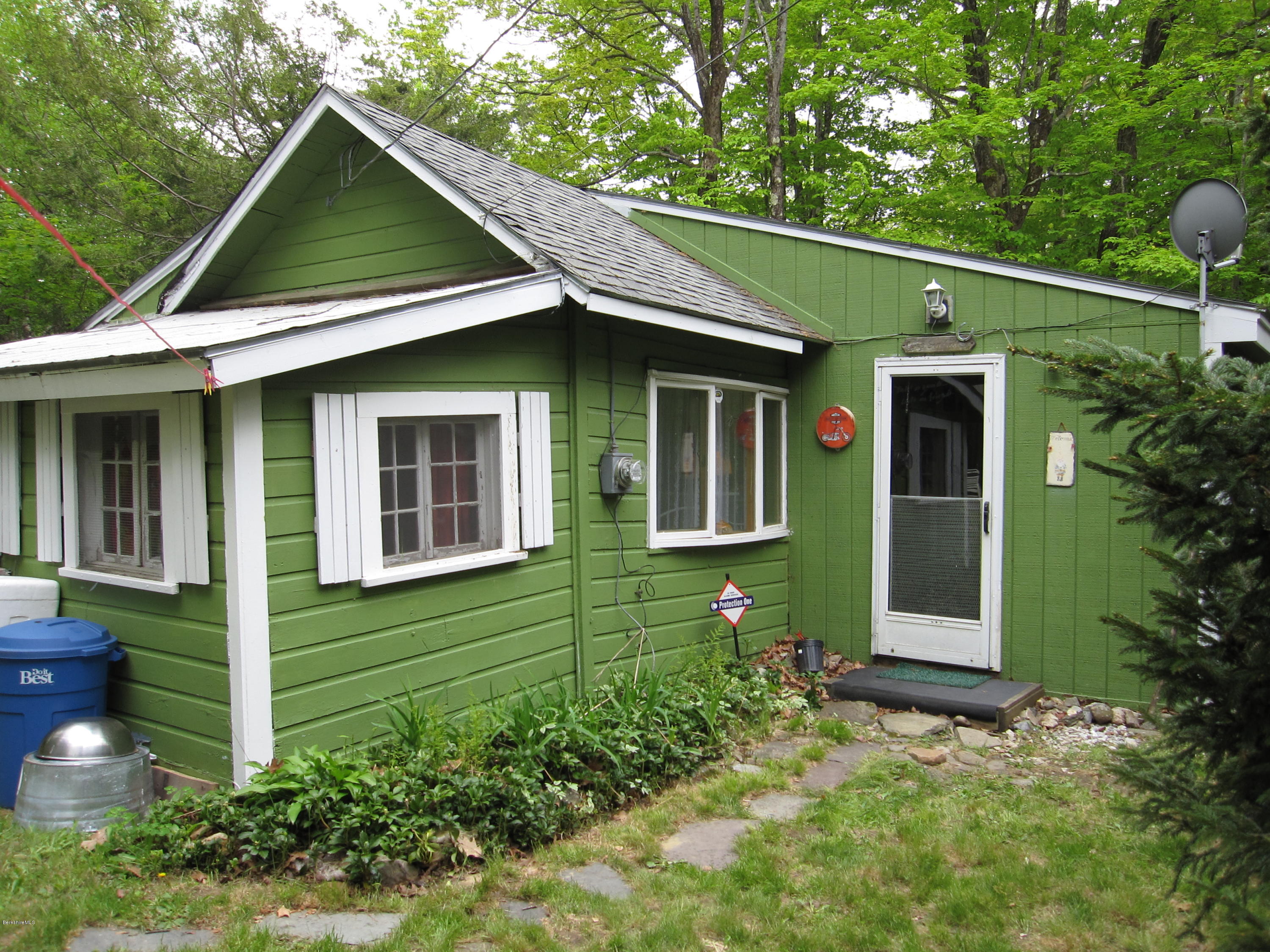 11 Phelps Road Florida, MA 01247 - Photo 1 of 9 a front view of a house with garden
