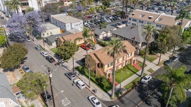 an aerial view of multiple houses with yard