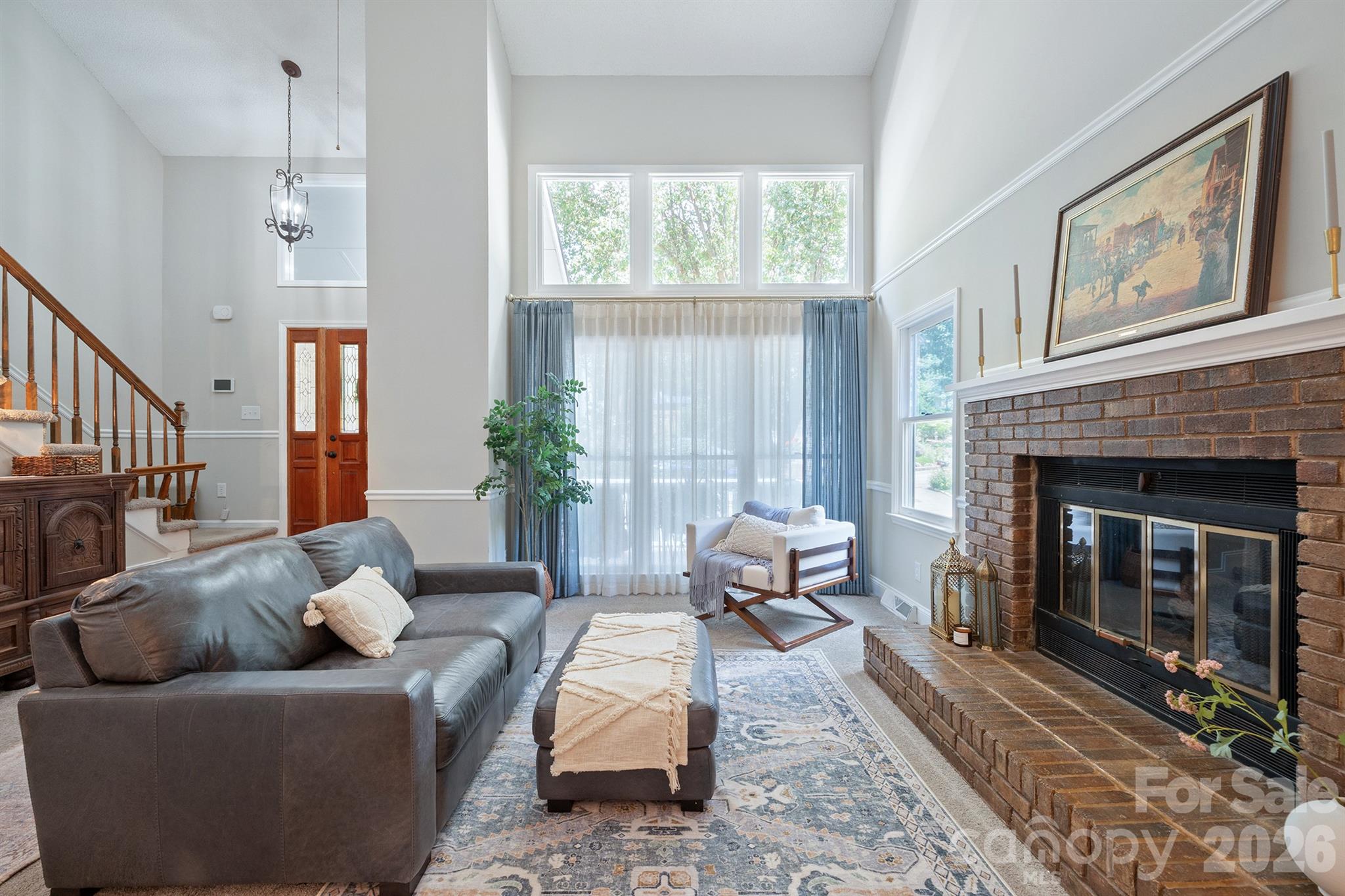 19017 Kailua Circle Tega Cay, SC 29708 - Photo 3 of 46 a living room with furniture and a fireplace