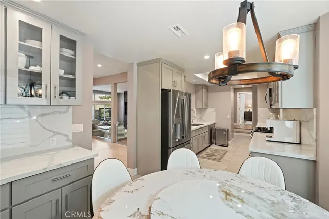 a bedroom with furniture and a flat screen tv
