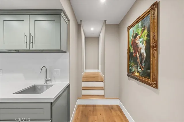 a bedroom with a bed and a view of kitchen