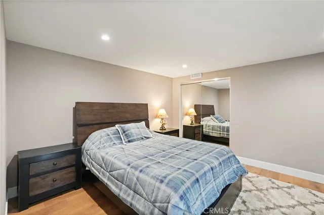 a bedroom with a bed and a dresser