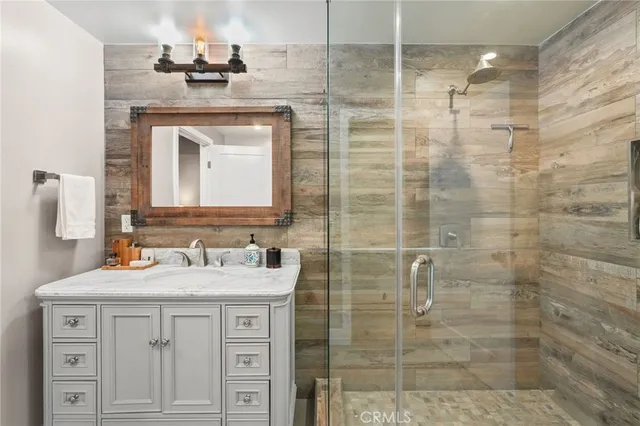 a bedroom with two beds and a window