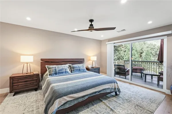 a living room with furniture a rug and white walls
