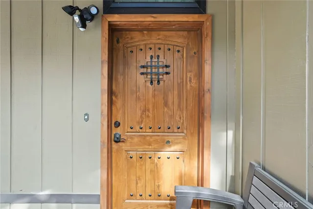 a living room with furniture fireplace and a large window