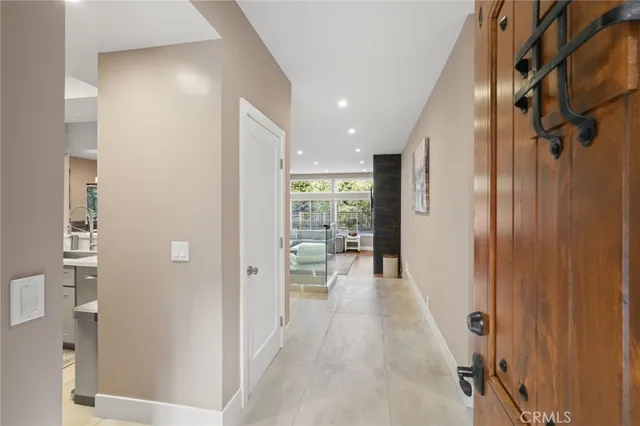 a dining room with furniture a chandelier and window