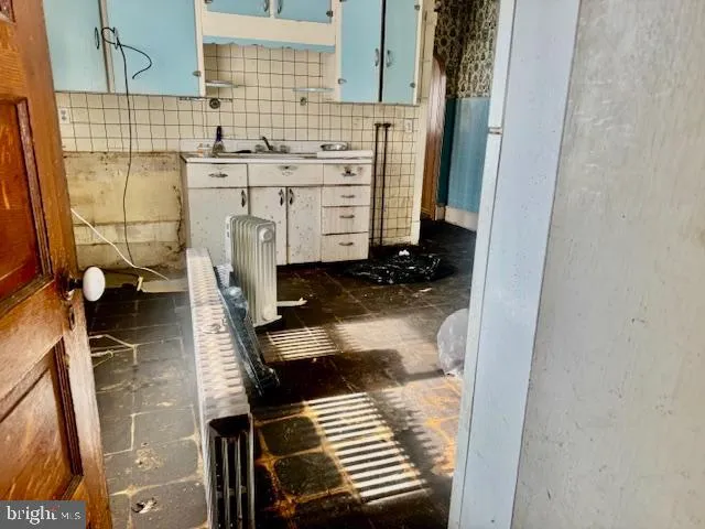 a bathroom with a glass door shower