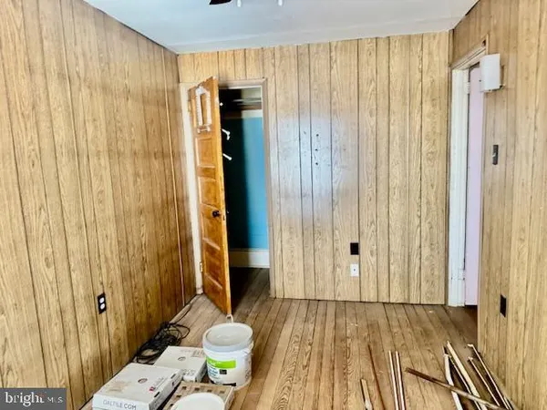 a bedroom with a bed and a table