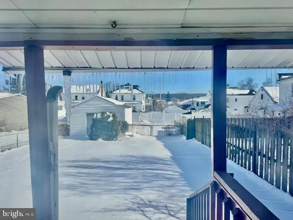 a kitchen with a refrigerator and a table