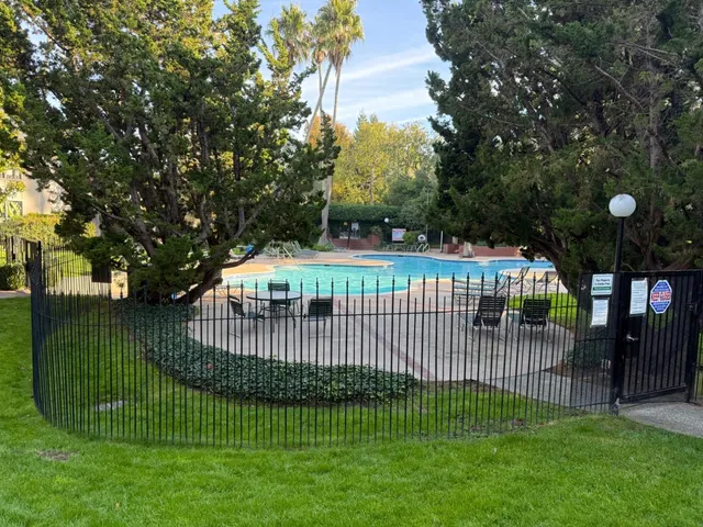 a view of a swimming pool and deck