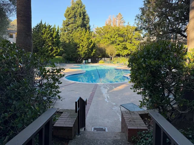an aerial view of a house with outdoor space