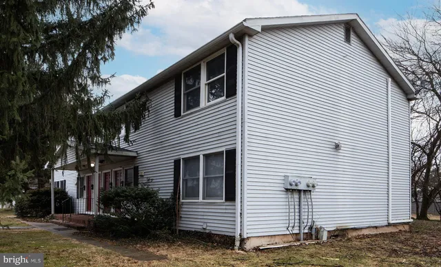a view of a house with a yard and garage