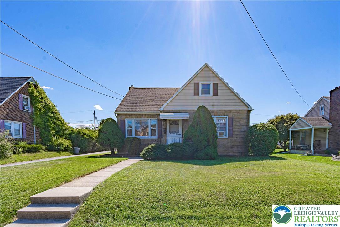 1115 Chestnut Street Coplay, PA 18037 - Photo 2 of 32 a front view of a house with a yard