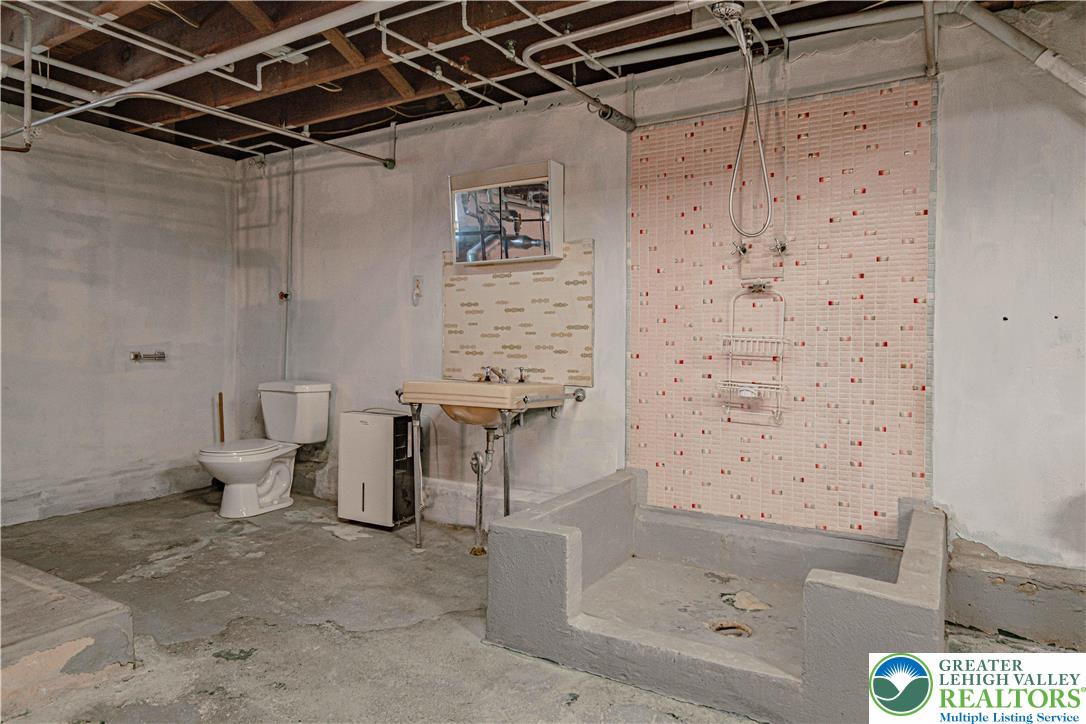 1115 Chestnut Street Coplay, PA 18037 - Photo 25 of 32 a bathroom with a toilet and shower