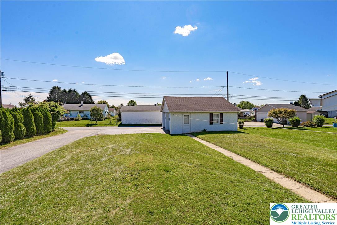 1115 Chestnut Street Coplay, PA 18037 - Photo 30 of 32 a front view of a house with garden