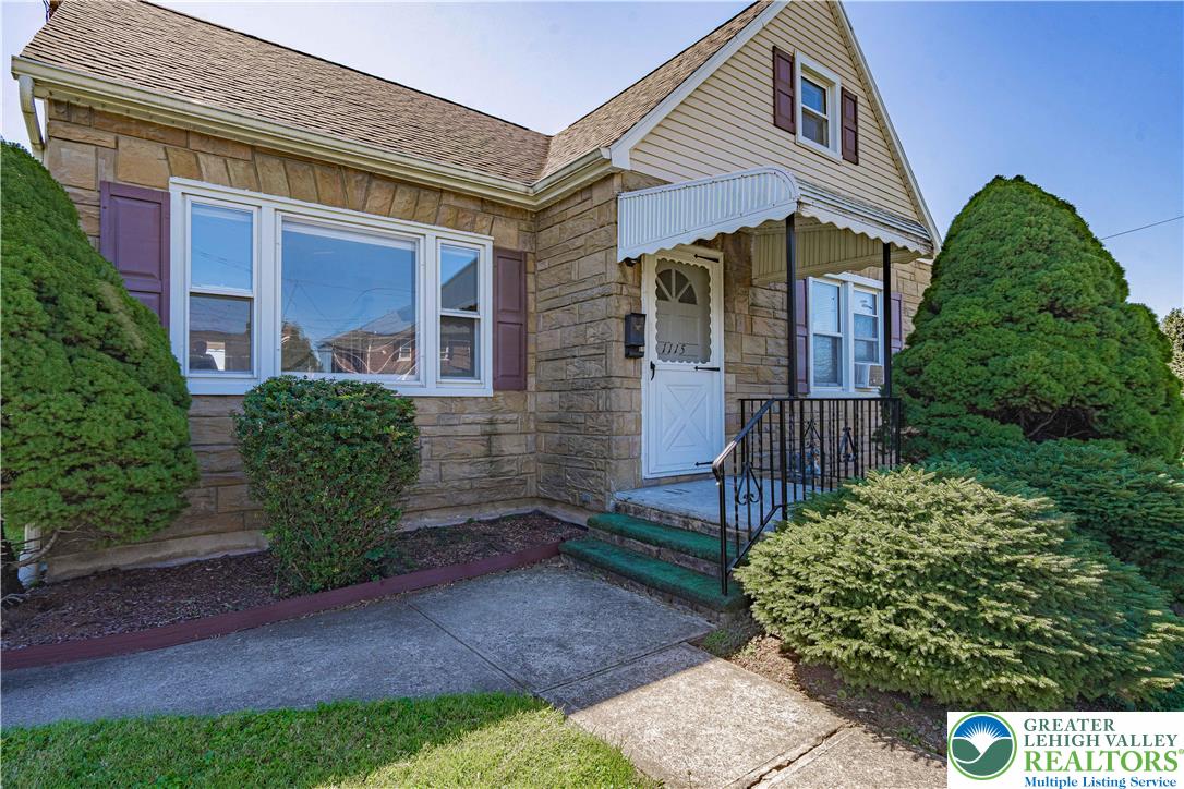 1115 Chestnut Street Coplay, PA 18037 - Photo 3 of 32 a front view of a house with garden