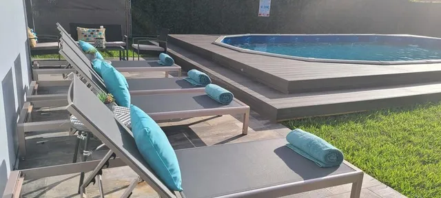 a view of backyard with seating area and trees