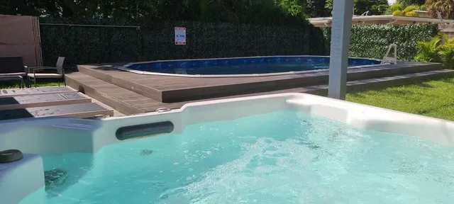 a view of a backyard with sitting area