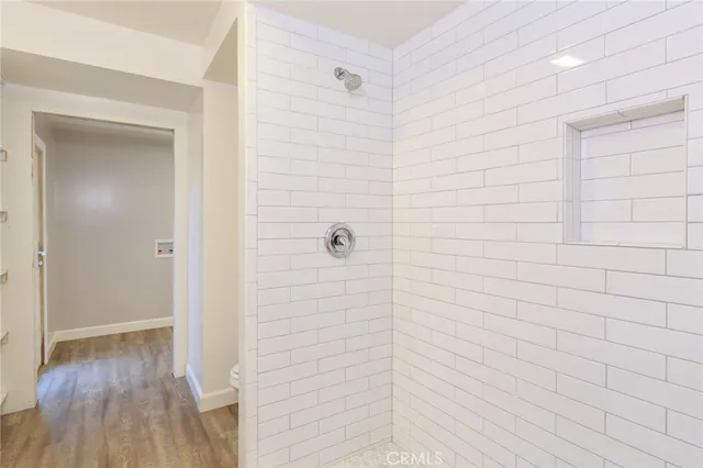 a kitchen with stainless steel appliances white cabinets and a sink
