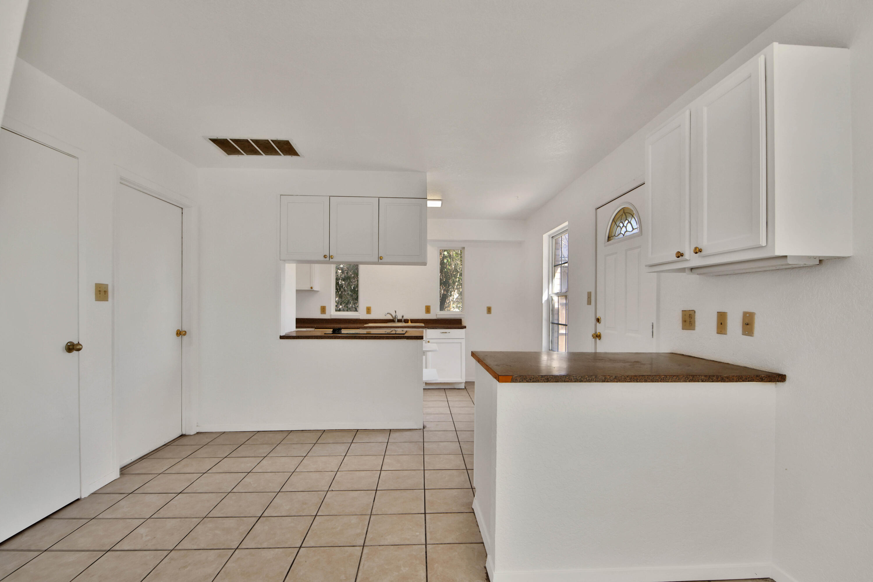 4913 56th Street Lubbock, TX 79414 - Photo 11 of 32 a kitchen with stainless steel appliances granite countertop a sink and cabinets