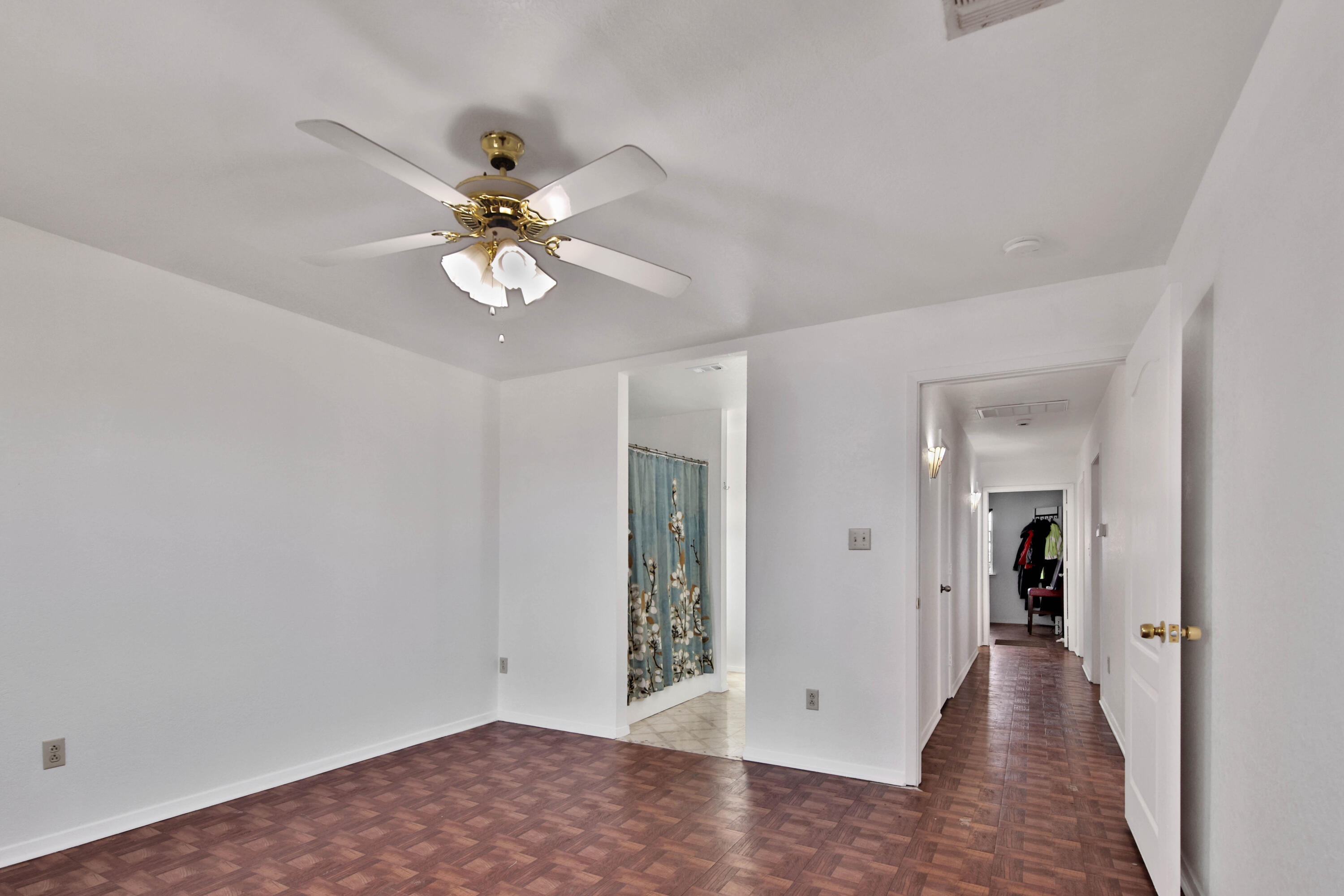 4913 56th Street Lubbock, TX 79414 - Photo 19 of 32 wooden floor in an empty room with a window
