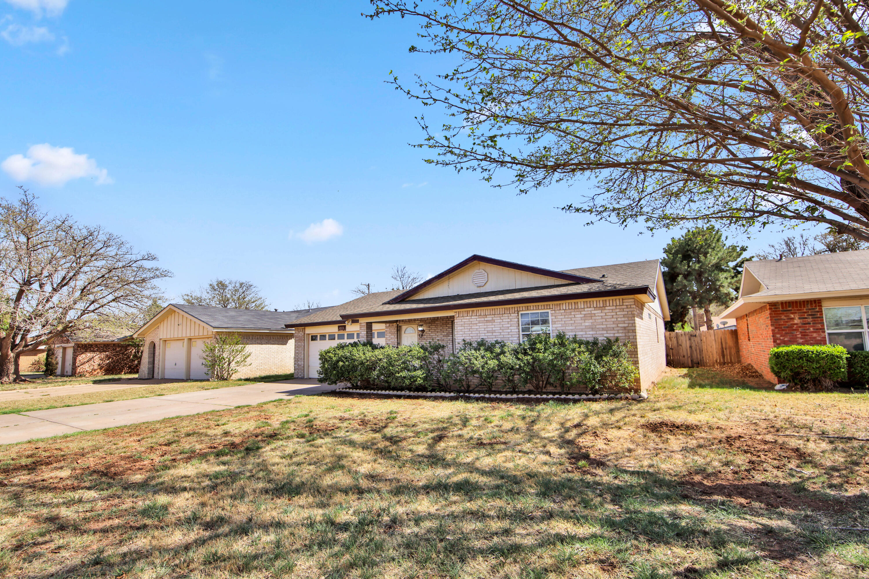 4913 56th Street Lubbock, TX 79414 - Photo 2 of 32 a front view of a house with a yard