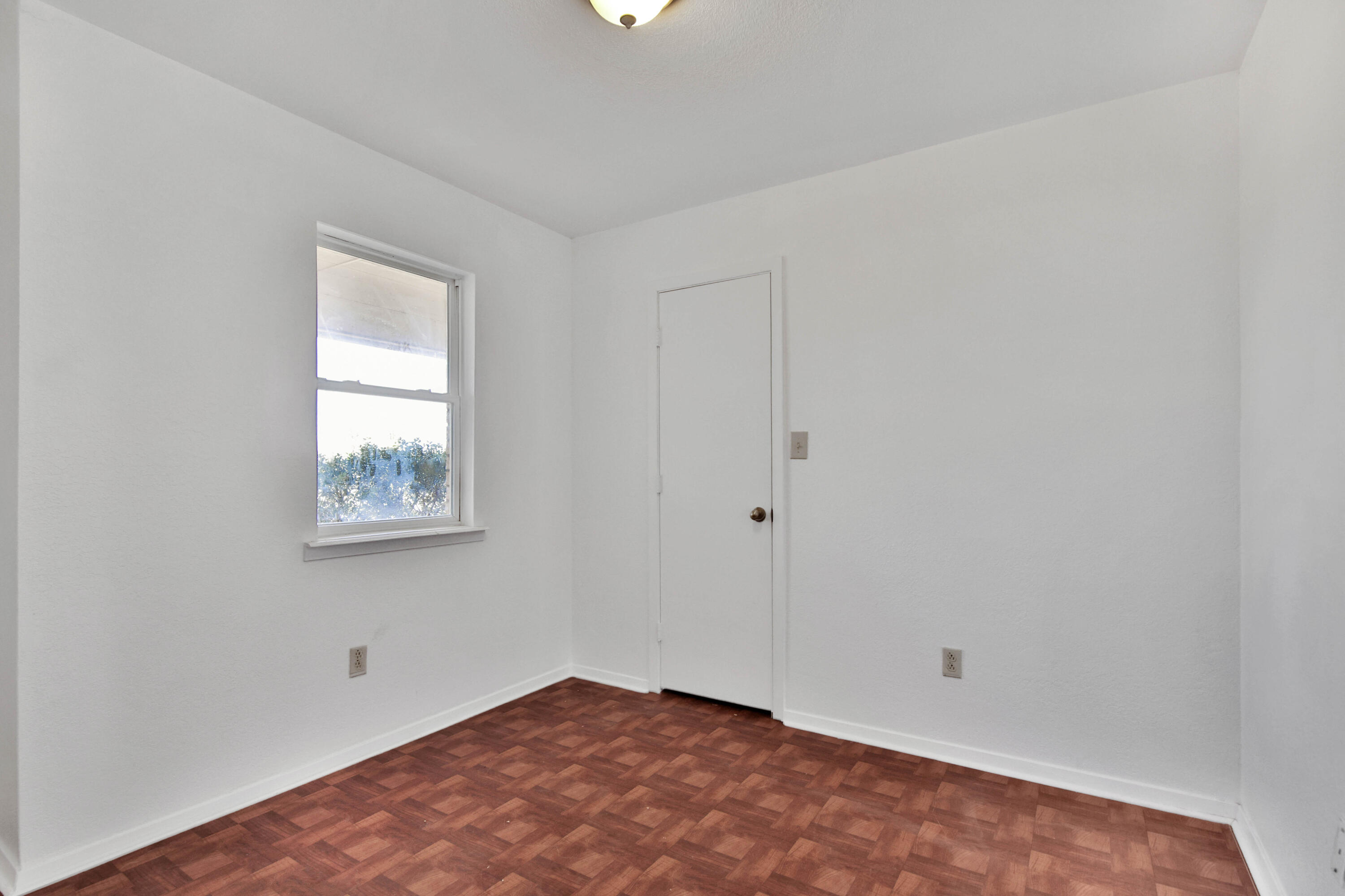 4913 56th Street Lubbock, TX 79414 - Photo 25 of 32 an empty room with windows