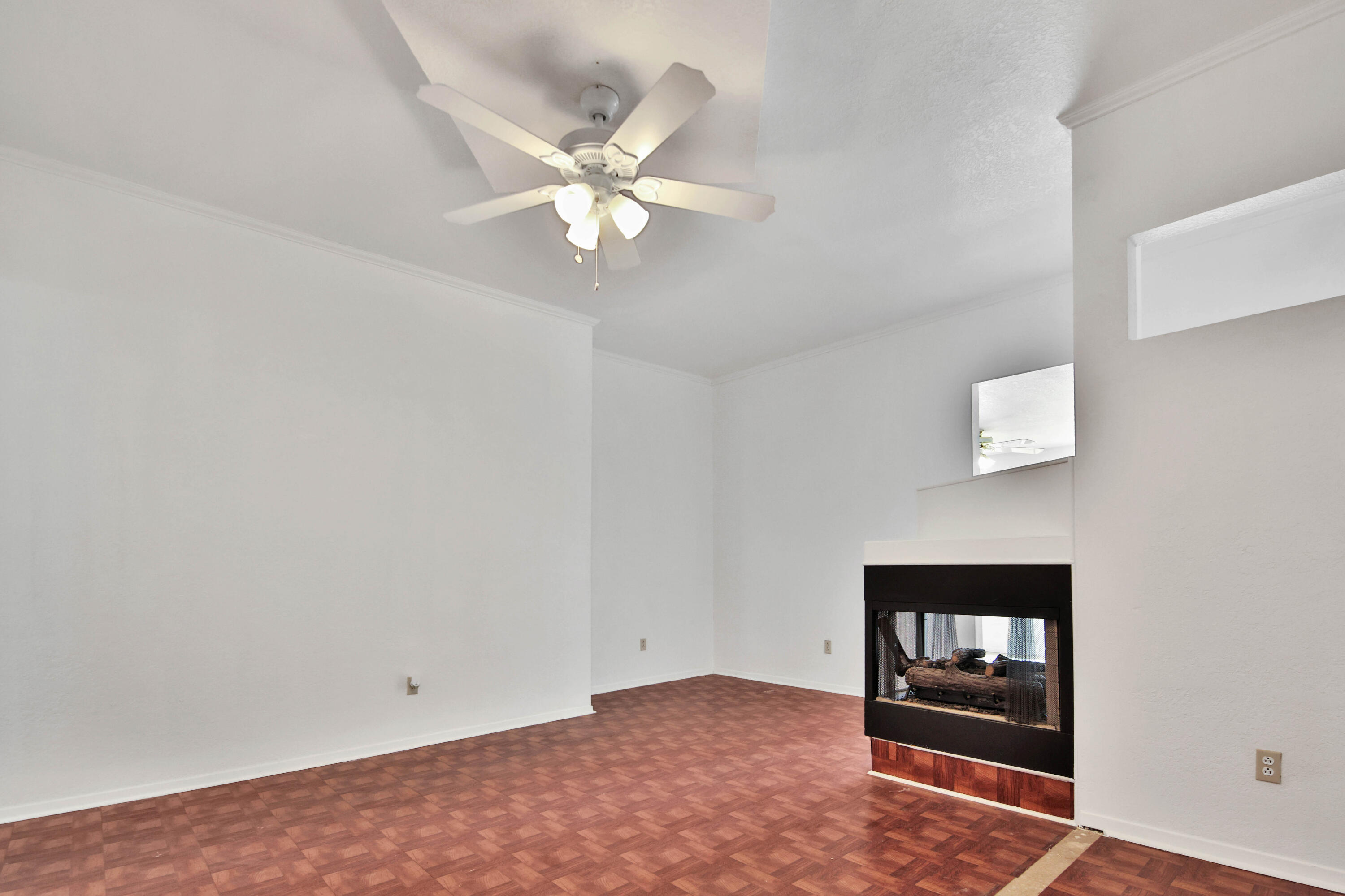 4913 56th Street Lubbock, TX 79414 - Photo 6 of 32 a view of an empty room with a window