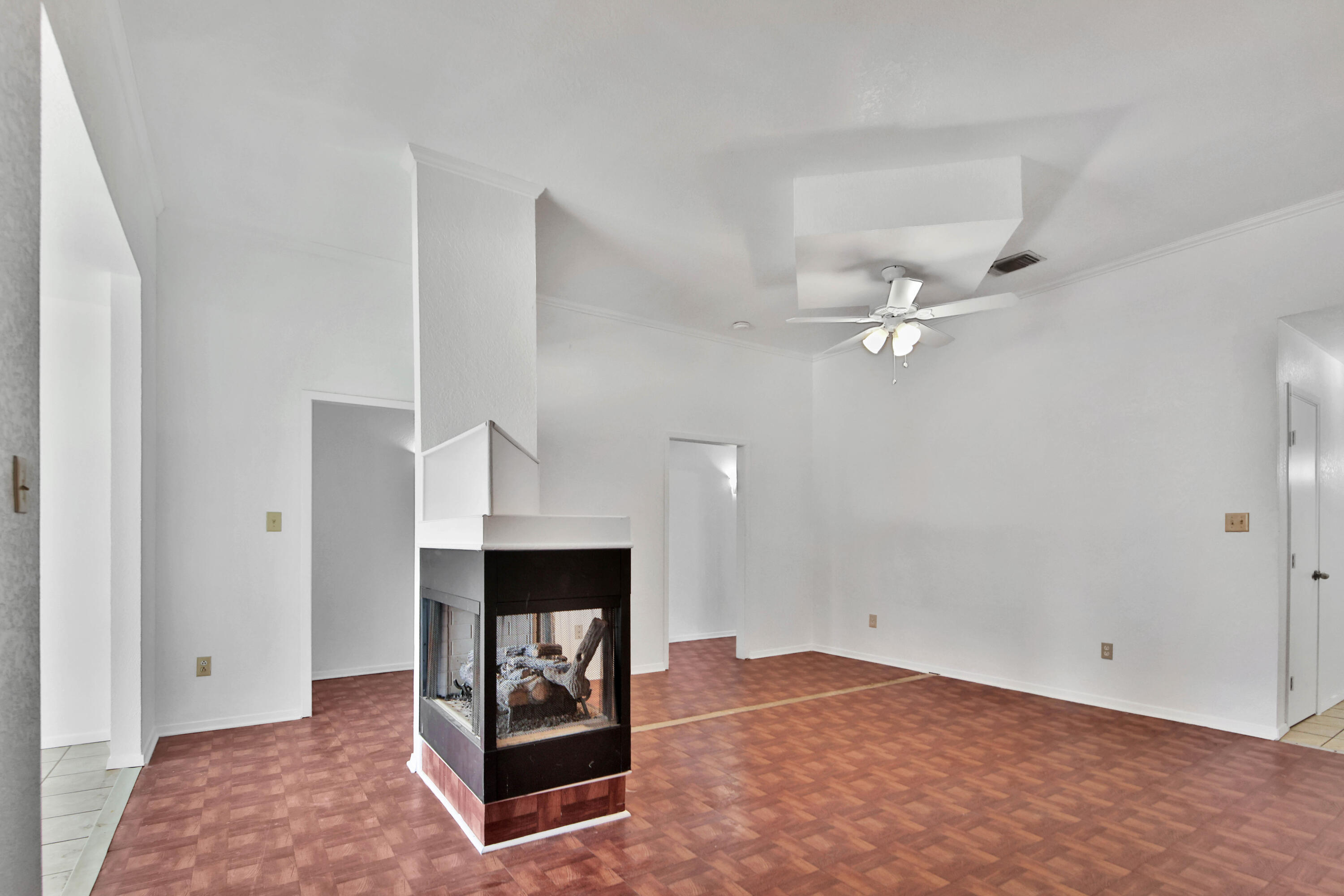 4913 56th Street Lubbock, TX 79414 - Photo 7 of 32 a living room with furniture and a fireplace