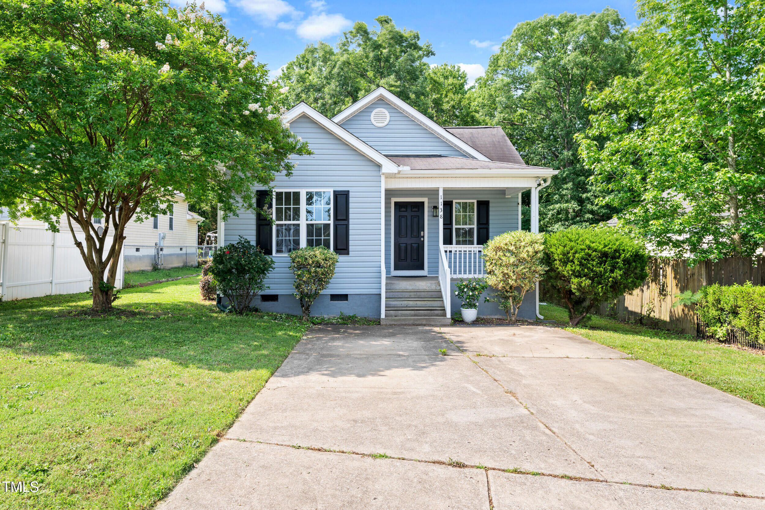 1138 Ricochet Drive Raleigh, NC 27610 - Photo 3 of 27 a front view of a house with garden
