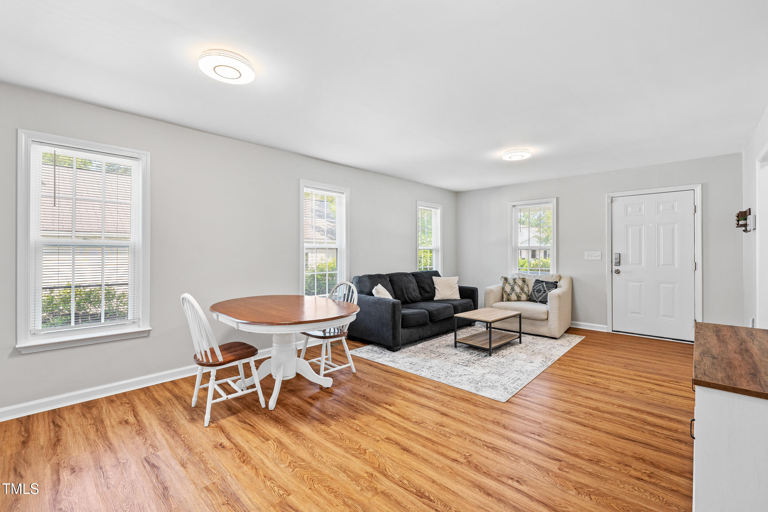 1138 Ricochet Drive Raleigh, NC 27610 - Photo 7 of 27 a living room with furniture and a wooden floor