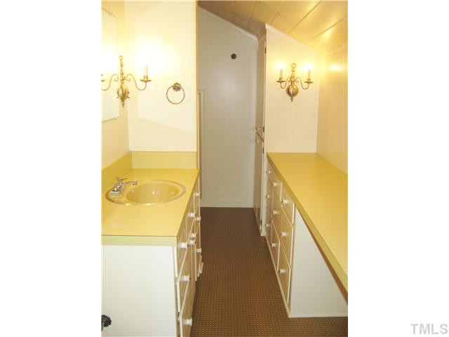 232-c C Cc Routh Road Bear Creek, NC 27207 - Photo 17 of 24 a bathroom with a tub sink and mirror