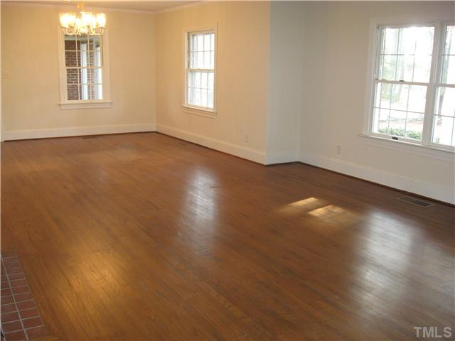 232-c C Cc Routh Road Bear Creek, NC 27207 - Photo 3 of 24 an empty room with wooden floor and windows