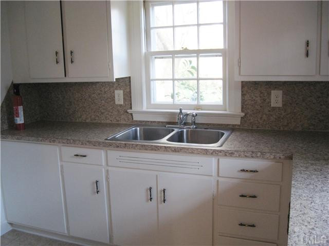 232-c C Cc Routh Road Bear Creek, NC 27207 - Photo 10 of 24 a kitchen with appliances cabinets and a window