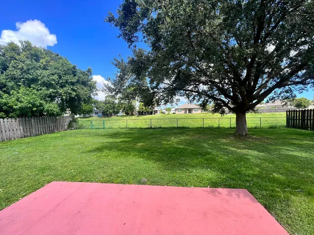a bathroom with a double vanity sink toilet and a mirror