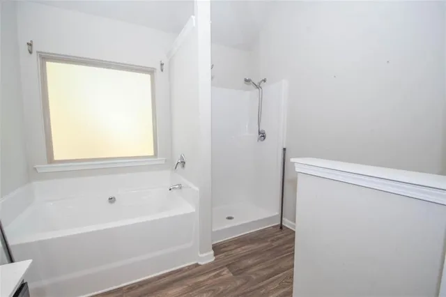 a white bath tub sitting next to a window