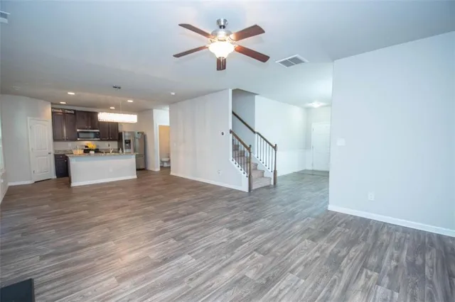 a view of a kitchen with a stove cabinets and wooden floor