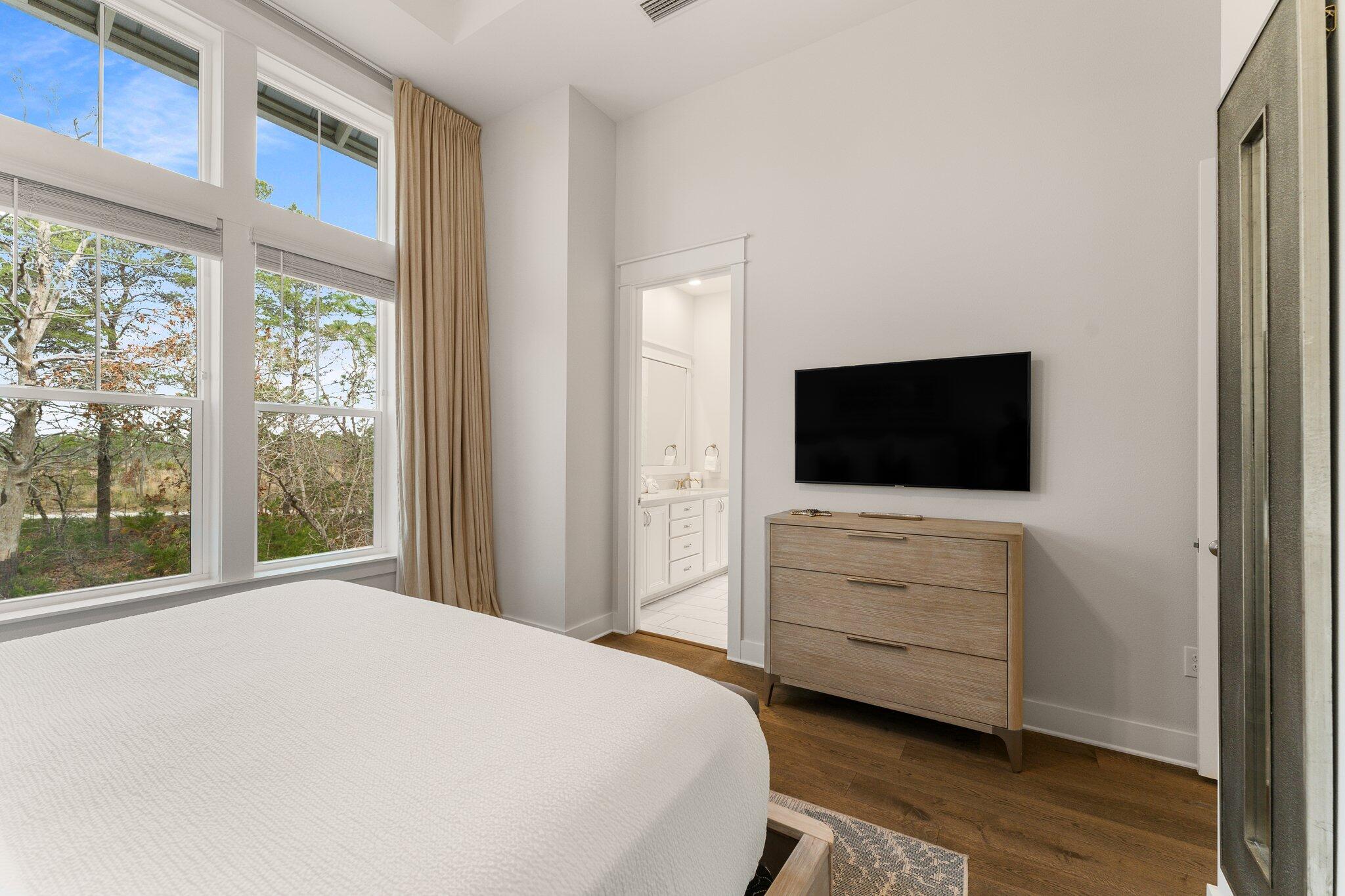117 Pine Lands Loop Inlet Beach, FL 32461 - Photo 18 of 48 a bedroom with a bed and a flat screen tv