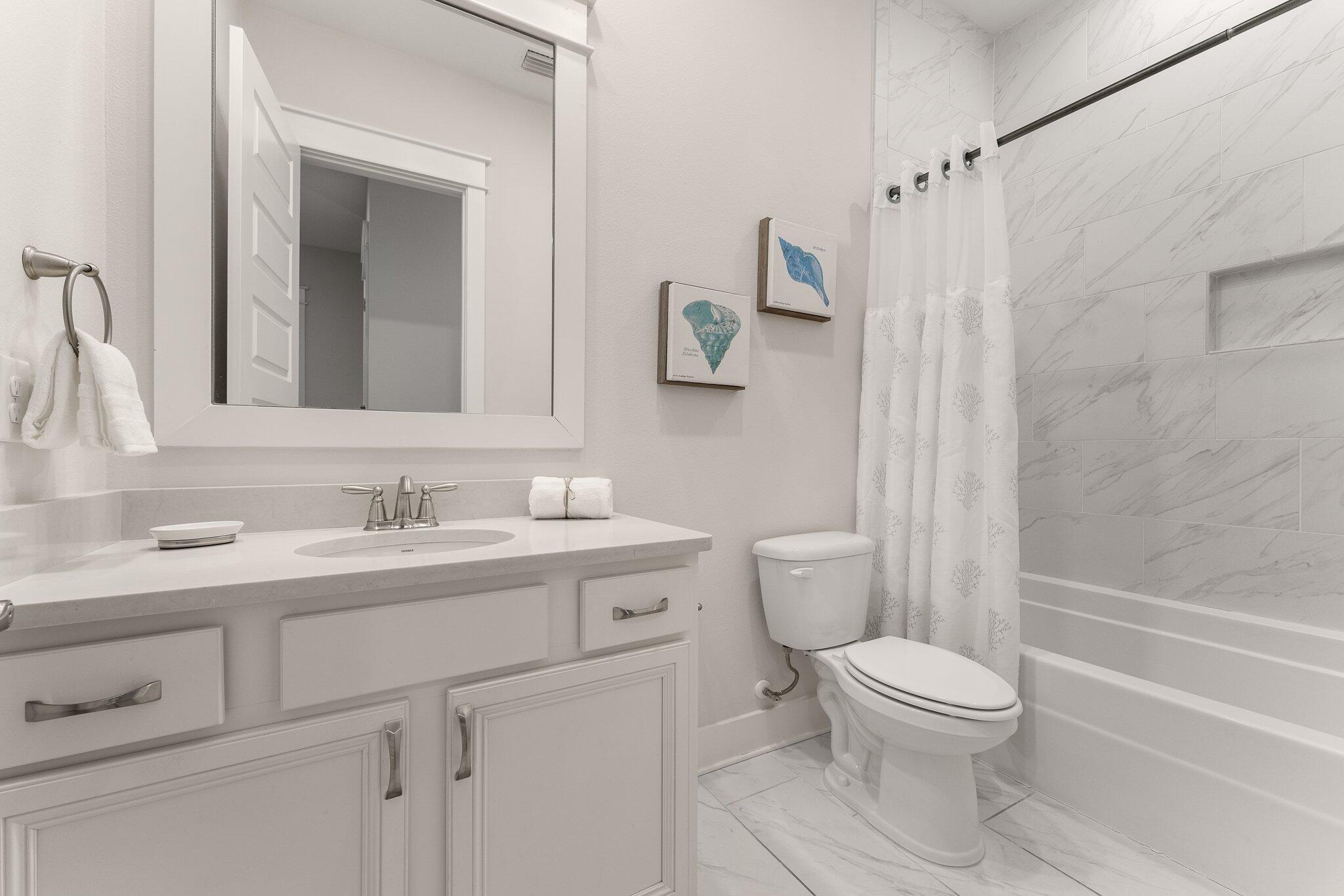117 Pine Lands Loop Inlet Beach, FL 32461 - Photo 26 of 48 a bathroom with a granite countertop toilet sink and mirror