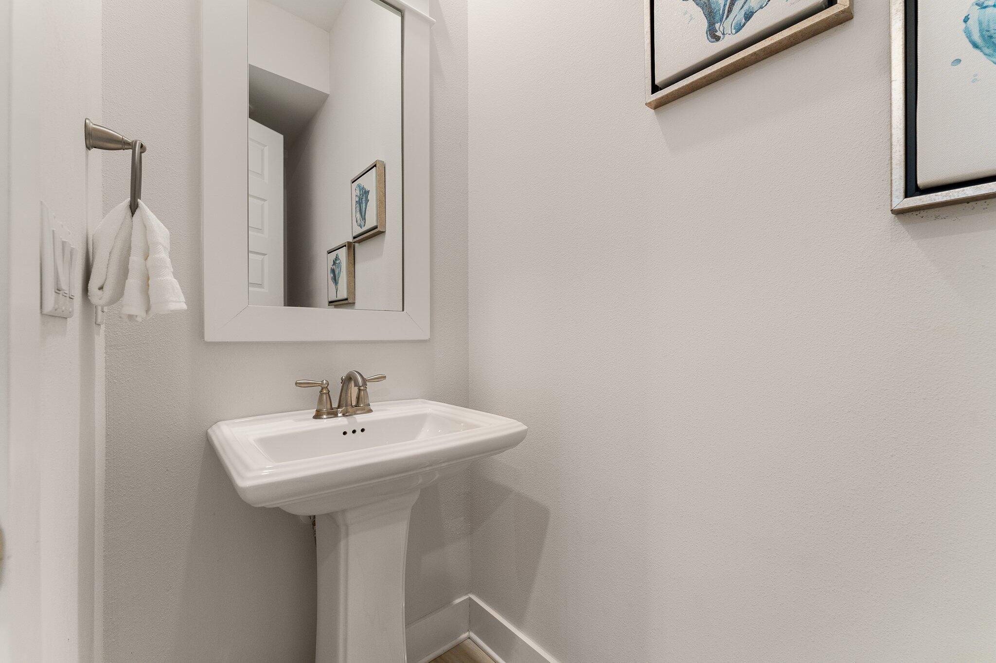 117 Pine Lands Loop Inlet Beach, FL 32461 - Photo 27 of 48 a bathroom with a sink and a mirror